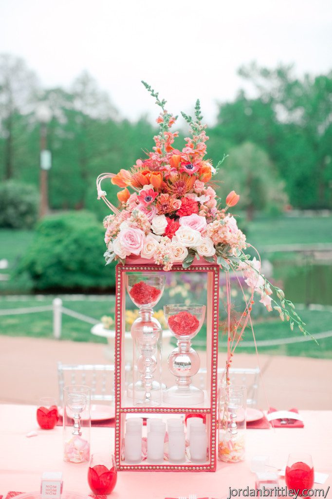 Unique centerpiece on custom stand in shades of coral