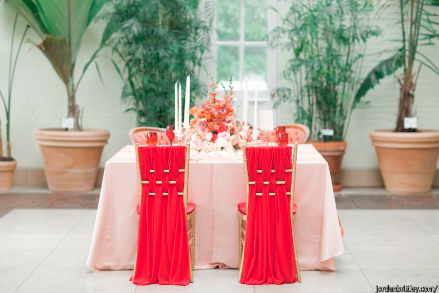 Blush table with red chiffon Chiavari chairs