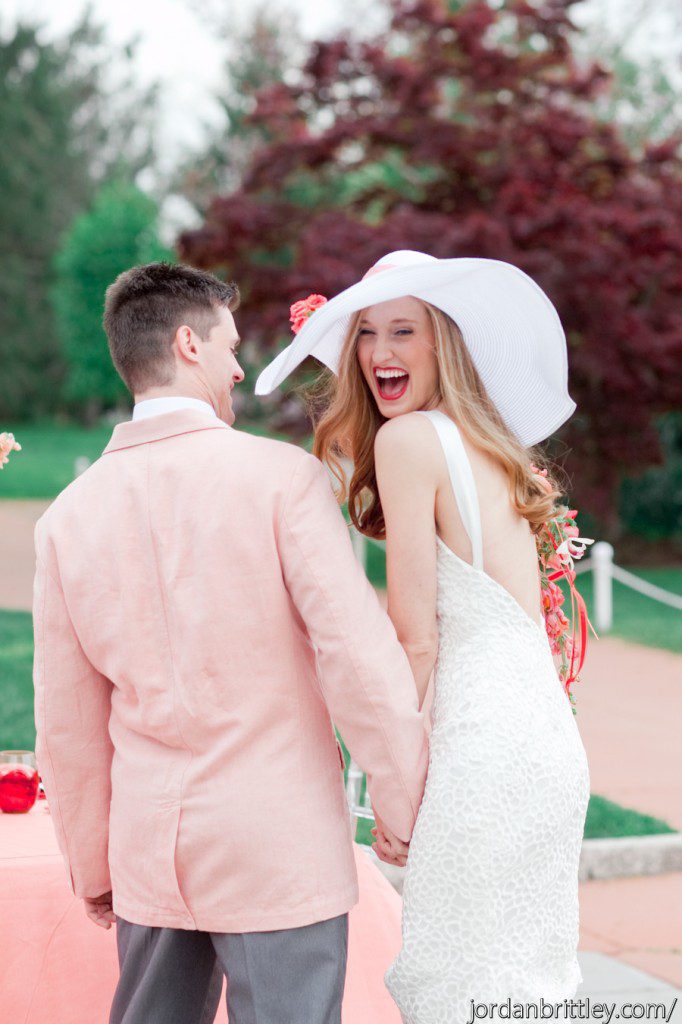 Happy bride and groom bride wedding hat peach groom coat