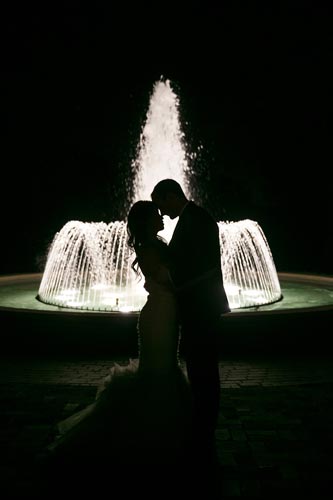 Bride & Groom kiss in front of fountain | St. Louis Weddings by Events Luxe